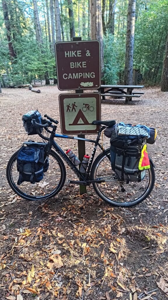 Bike near sign that says hike and bike camping